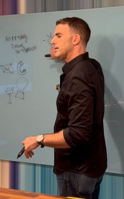 Josh Hedaya teaching at a whiteboard